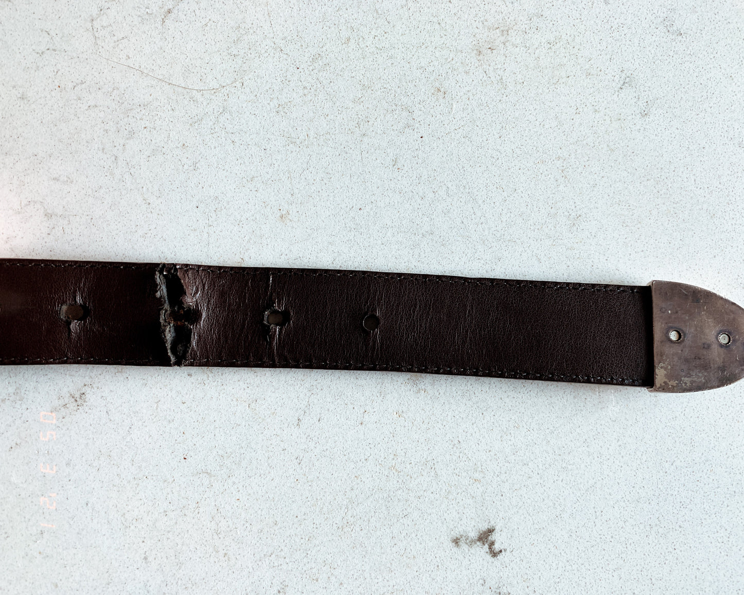 Brown leather embossed belt